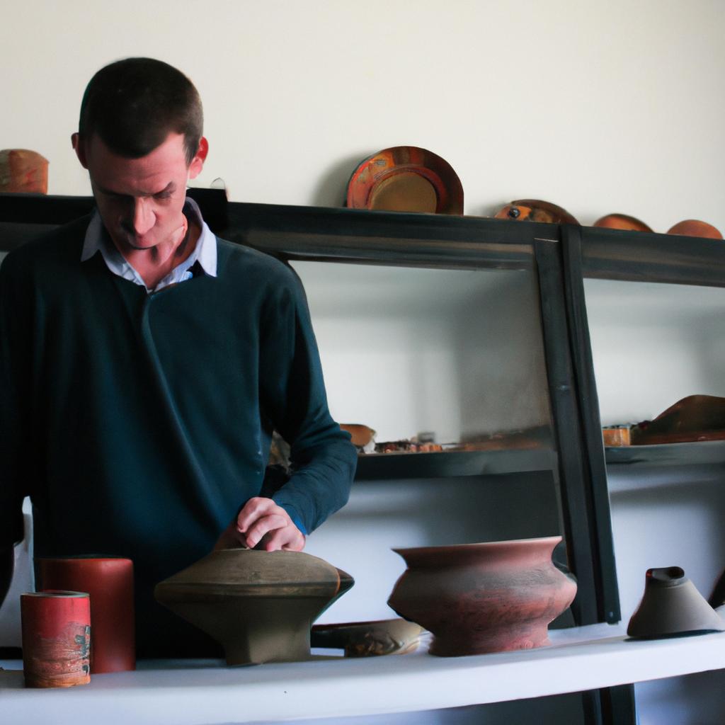 Person examining antique pottery collection