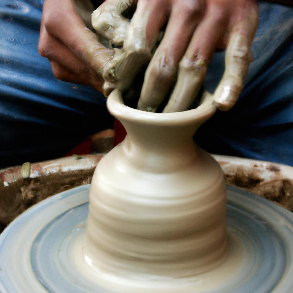 Potter shaping clay on wheel
