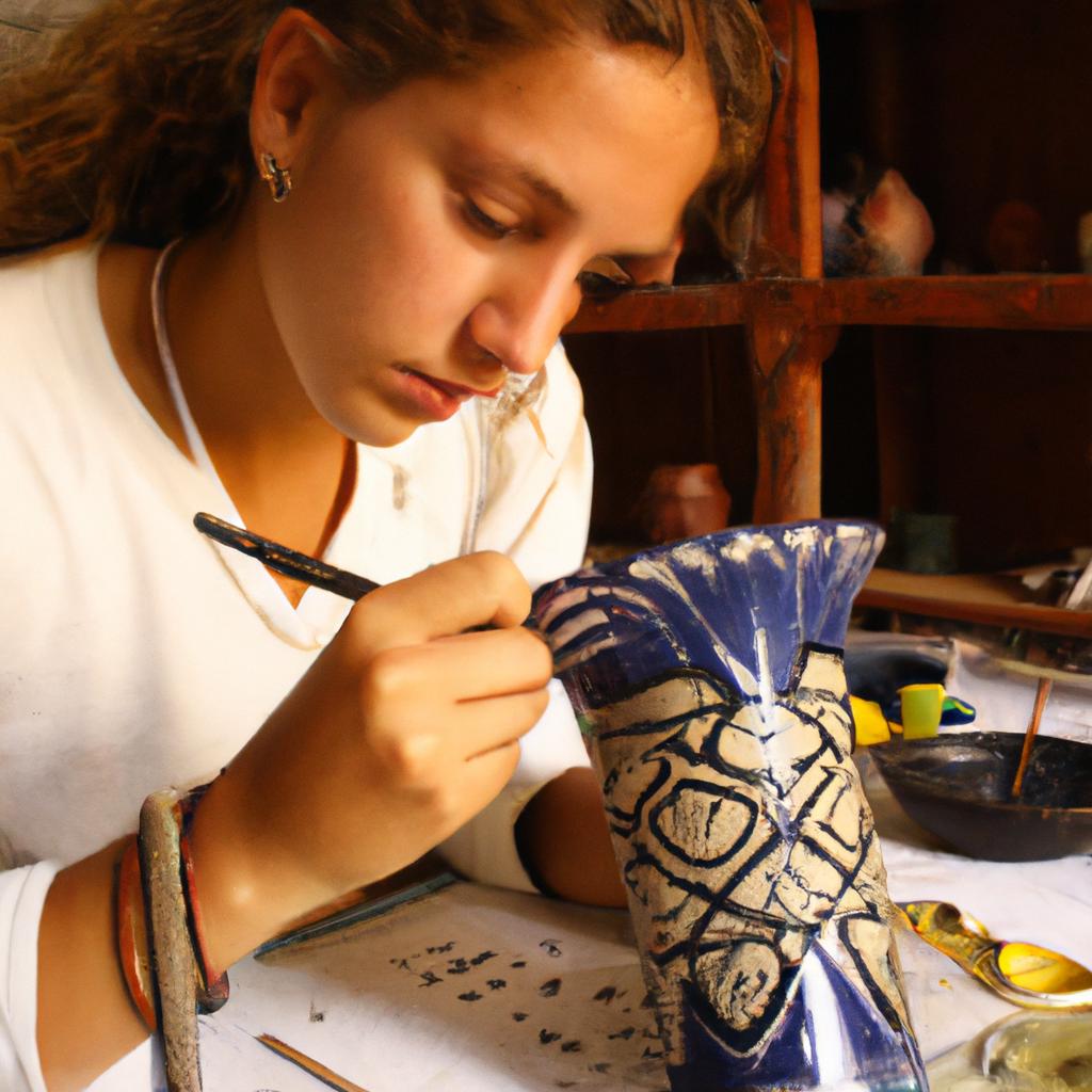 Woman painting intricate pottery designs
